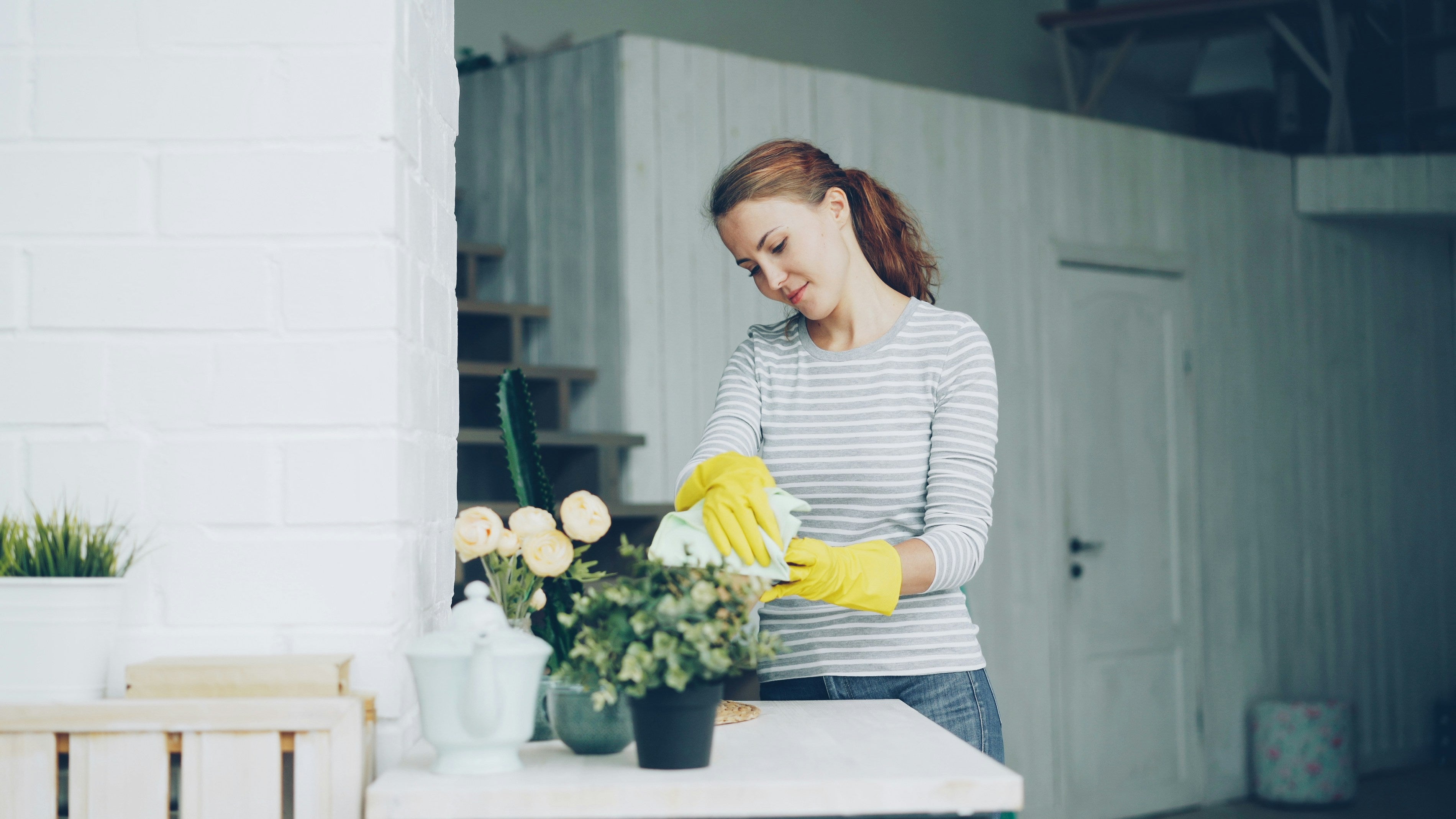 Professional house cleaner vacuuming with modern equipment in Jacksonville